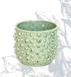 Green woven-style ceramic planter with handle — Light green spiky-textured ceramic planter with glossy finish | Plan My Wedding Africa